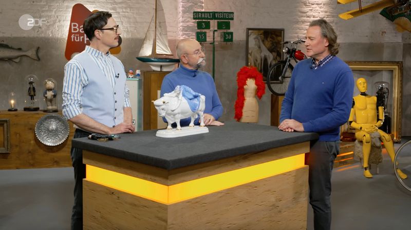 Andreas aus Arlesheim in der Schweiz brachte eine Porzellanplastik mit in die Sendung, die viele Jahre in einer Metzgerei ausgestellt war. Als die Filiale geschlossen wurde, erhielt sein Vater als ehemaliger Mitarbeiter die Figur zum Abschied. Nach dessen Tod bewahrte Andreas das Stück bis heute auf.